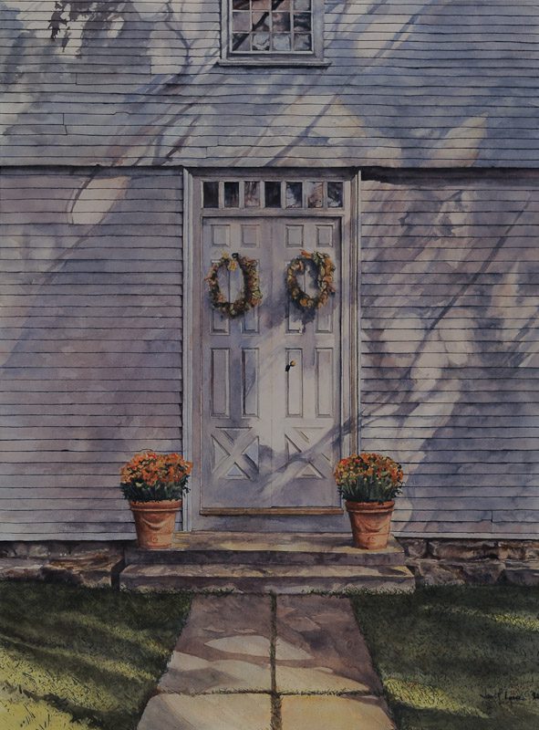White door with wreaths and potted plants.