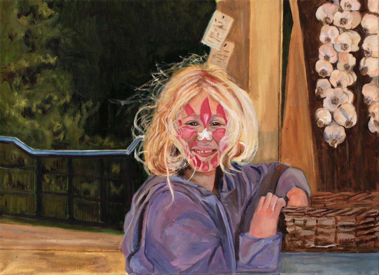 Child with face paint, smiling by basket.