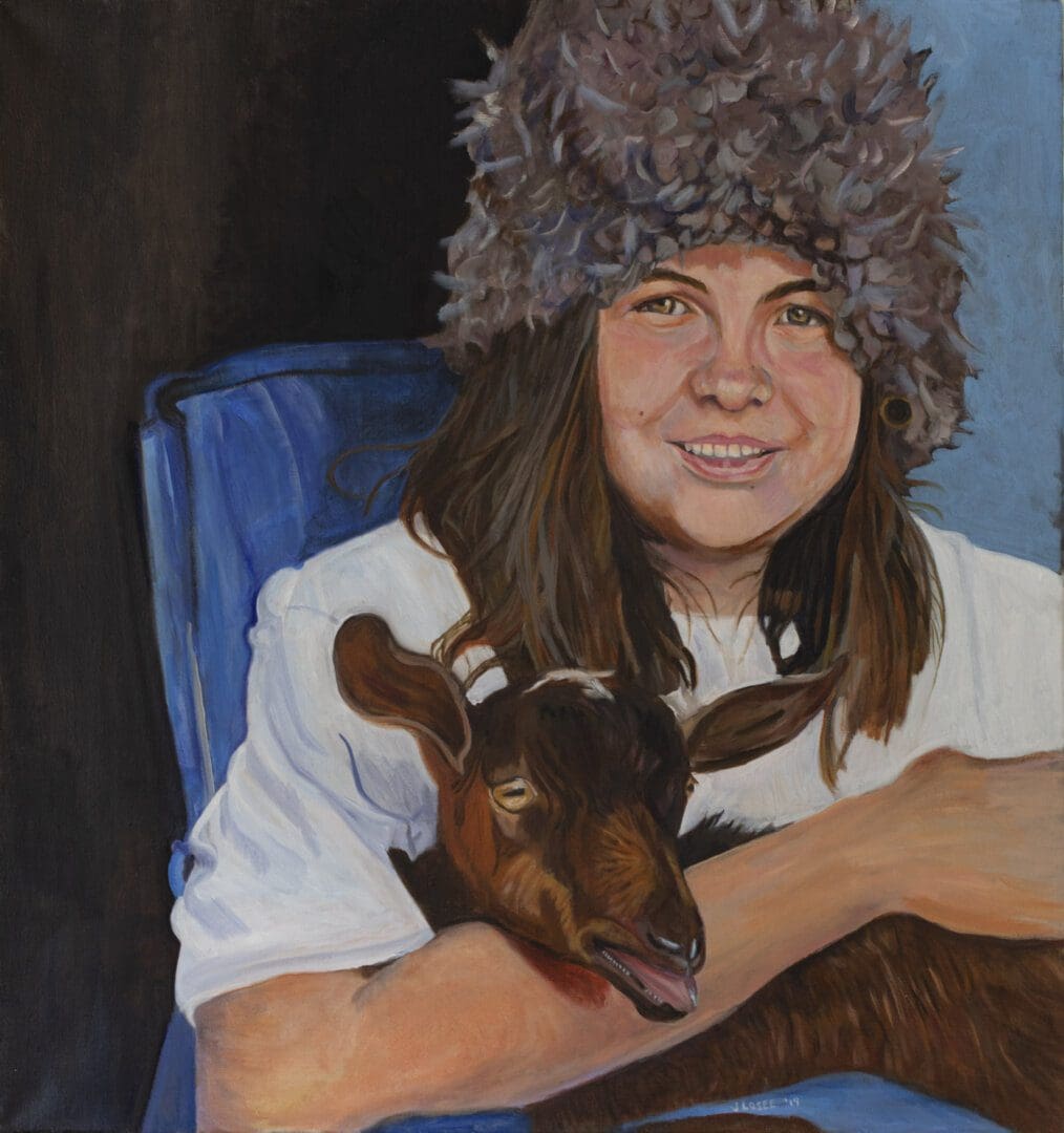Person with furry hat holding a goat.