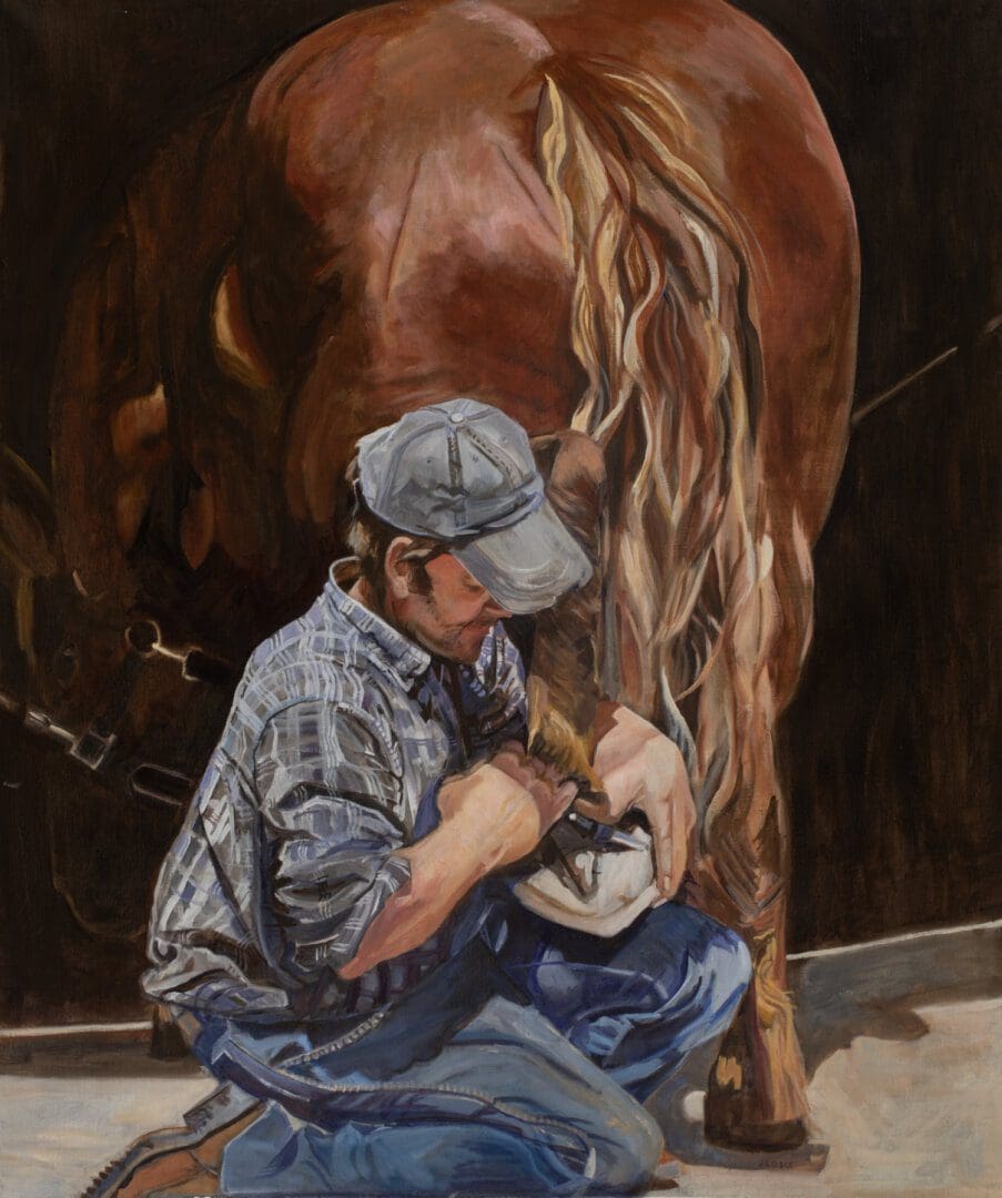 Man shoeing horse, wearing cap and plaid shirt.