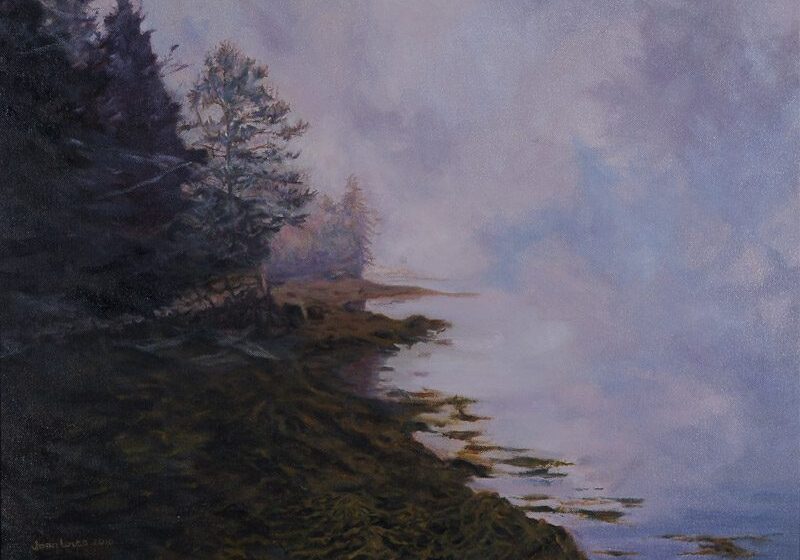 Foggy lakeside with trees and reflections.