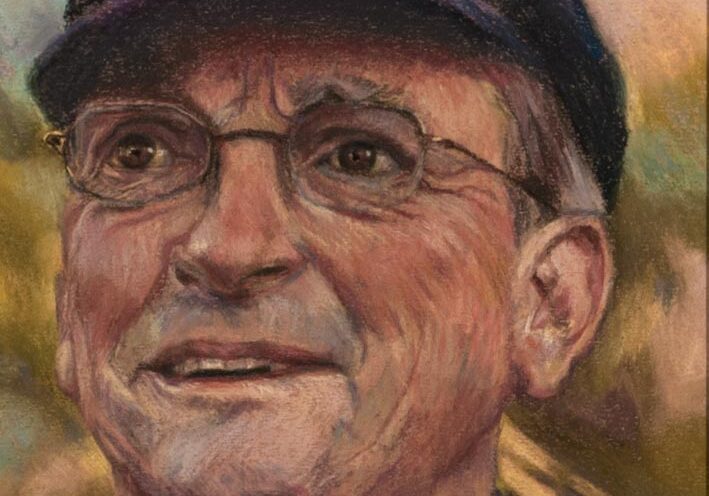 Portrait of an elderly man with glasses.