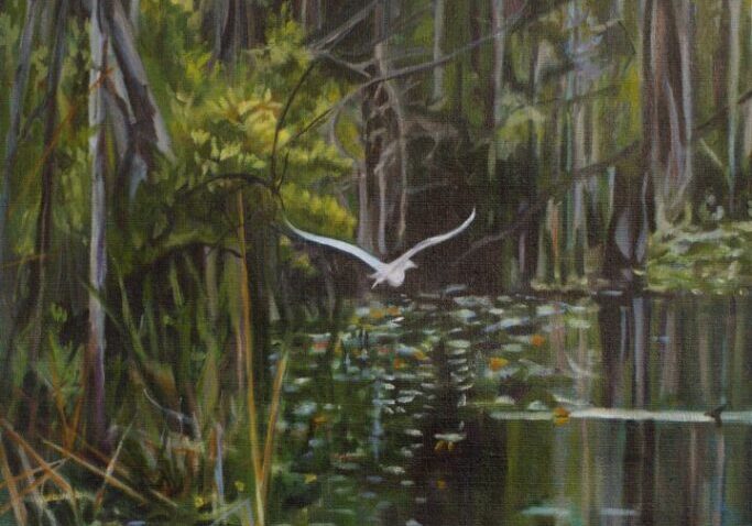 Bird flying over a tranquil forest river.