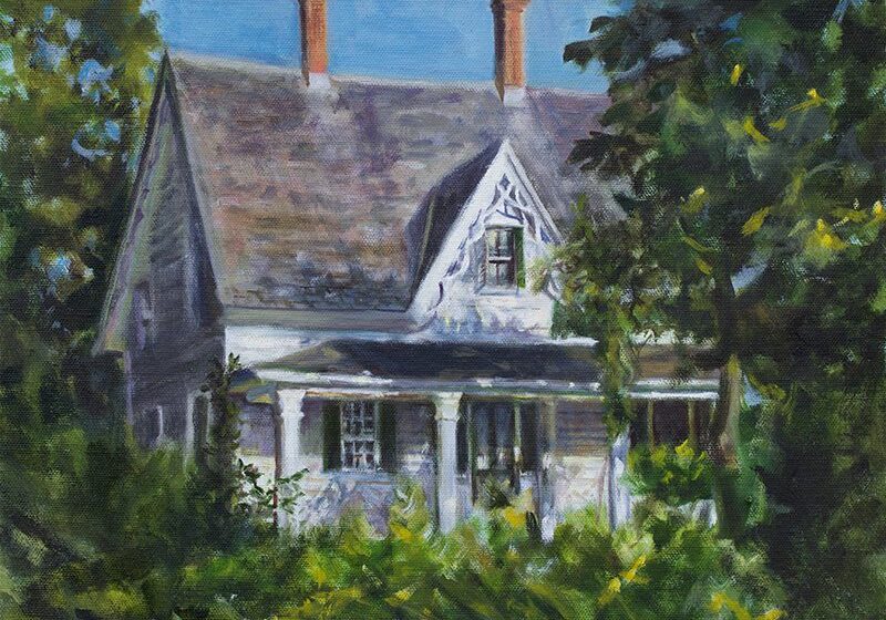 Historic house surrounded by lush greenery.